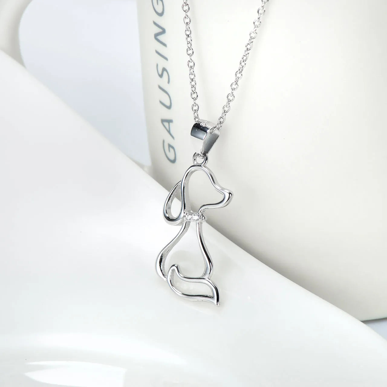 925 sterling silver dog pendant necklace with round bead chain on display