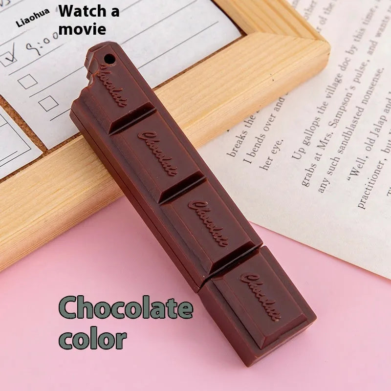 Chocolate ballpoint pen with cartoon food design in pink, beige, and brown colours
