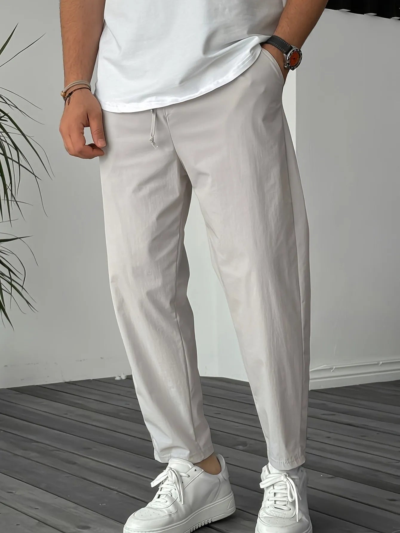 Men's khaki bamboo fibre drawstring trousers with straight leg and ribbon pocket