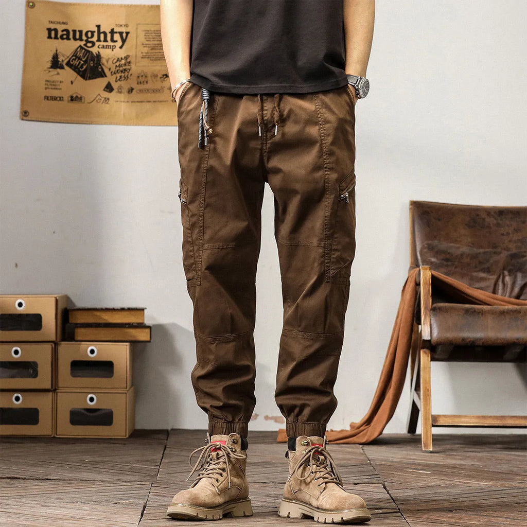 Men's cotton retro harem pants in tapered fit with ankle banding and zip fly