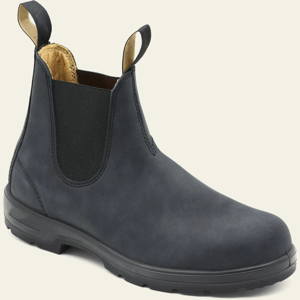 Vintage brown unisex Chelsea boots with a frosted finish, round toe, and low horseshoe heel on a wooden floor.