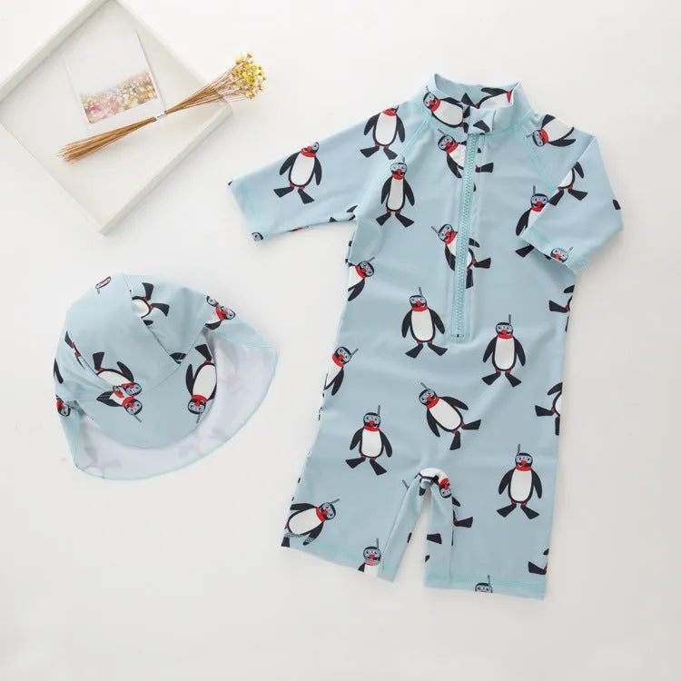 Boy's penguin print swim set with long sleeves and matching swimming cap for ages 2-7 years