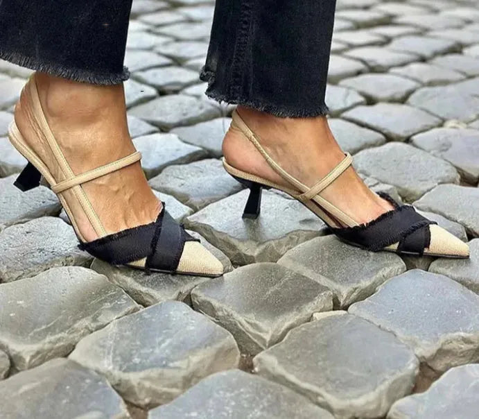 Apricot black women's pointed toe stiletto heel sandals with a buckle strap fastening.
