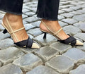 Apricot black women's pointed toe stiletto heel sandals with a buckle strap fastening.