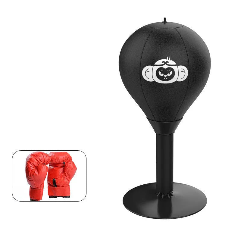 Tabletop boxing speed ball with suction cup base, inflatable PU leather sphere, and pump on a wooden desk.