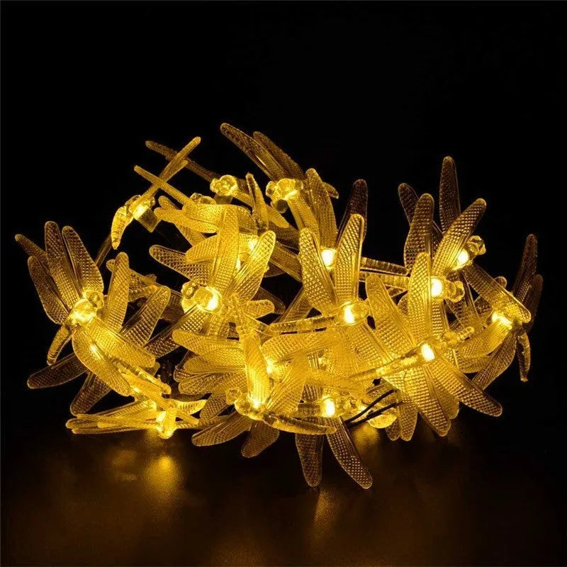 Outdoor solar LED string light with 30 warm white dragonfly lights and solar panel with ground spike