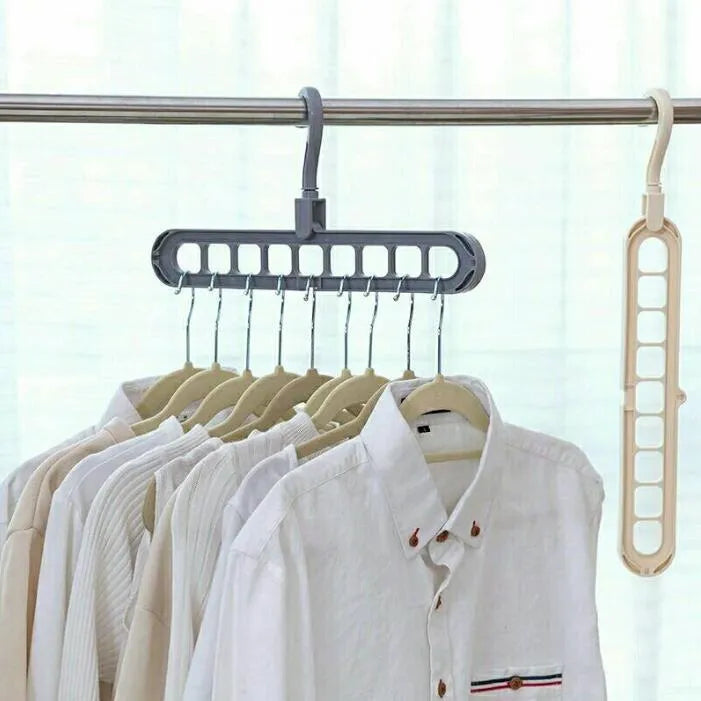 Plastic clothes hanger with rotating hook in pink colour, showing 33cm length dimension