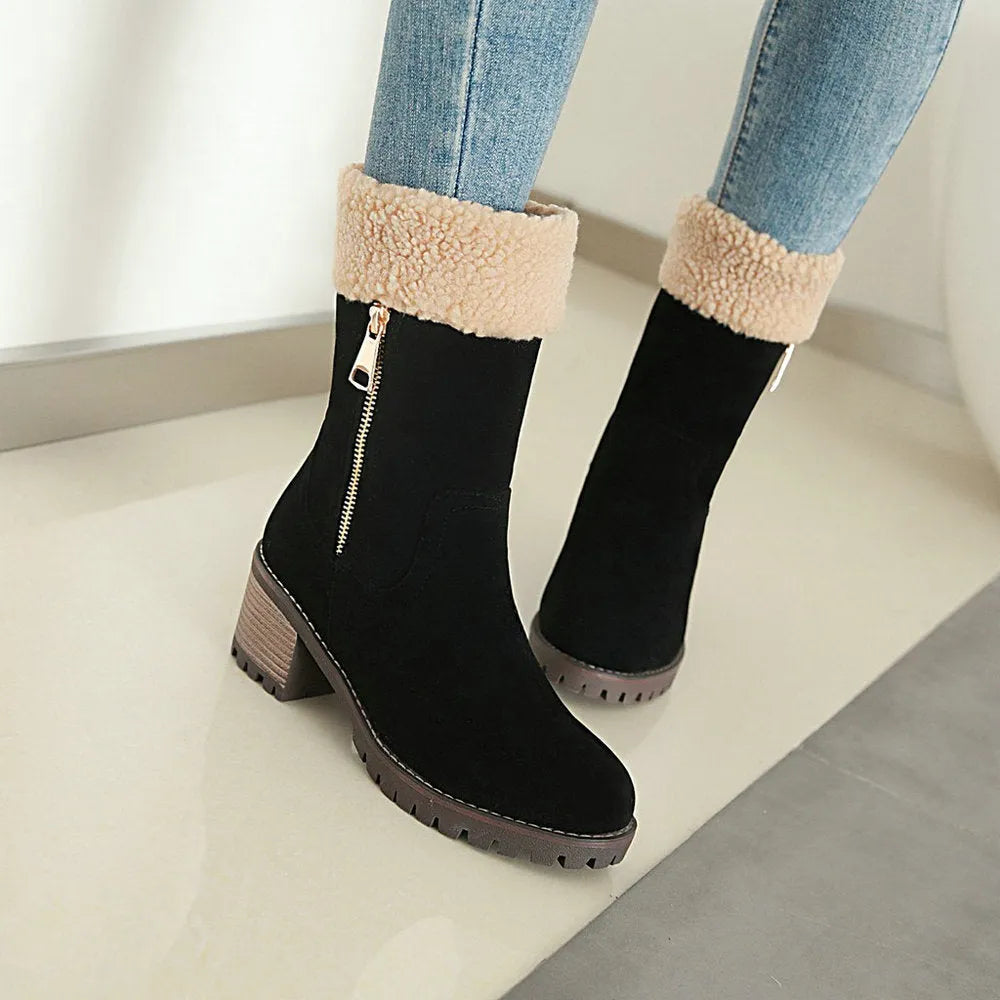 A pair of snow boots with a rubber sole and plush lining on a winter background.