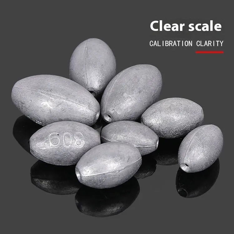 Tongxin olive-shaped rugby lead sinker for sea fishing with scale texture, showing plastic core construction.