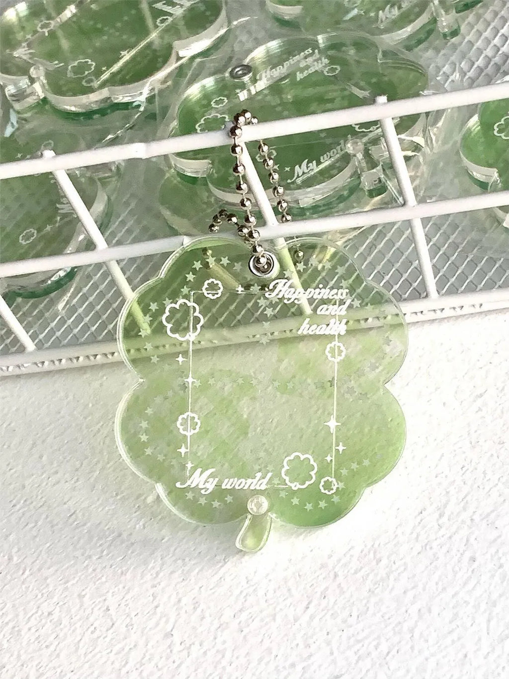 Acrylic four-leaf clover mobile phone pendant keychain in blue, green, and mint colours