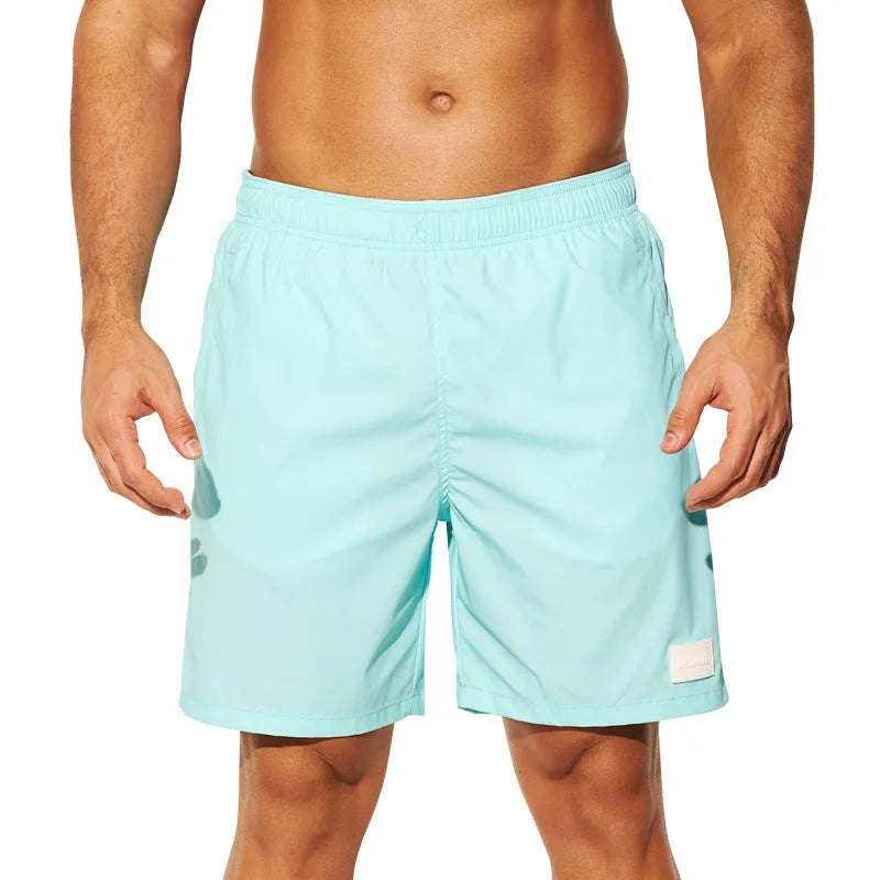 Men's quick-drying nylon sports shorts in blue with straight leg opening for beach and gym wear