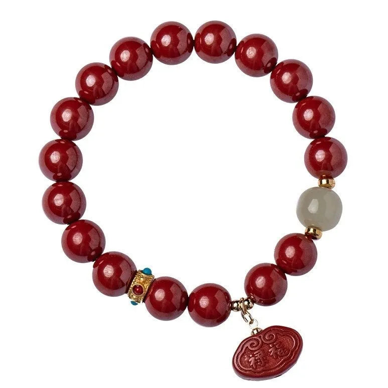 Natural cinnabar bracelet with Emperor sandstone design and Ping An Fu Lu motifs.
