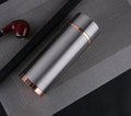 Stainless steel vacuum insulated thermo mug in gold finish with 380ml capacity and silver screw-top lid