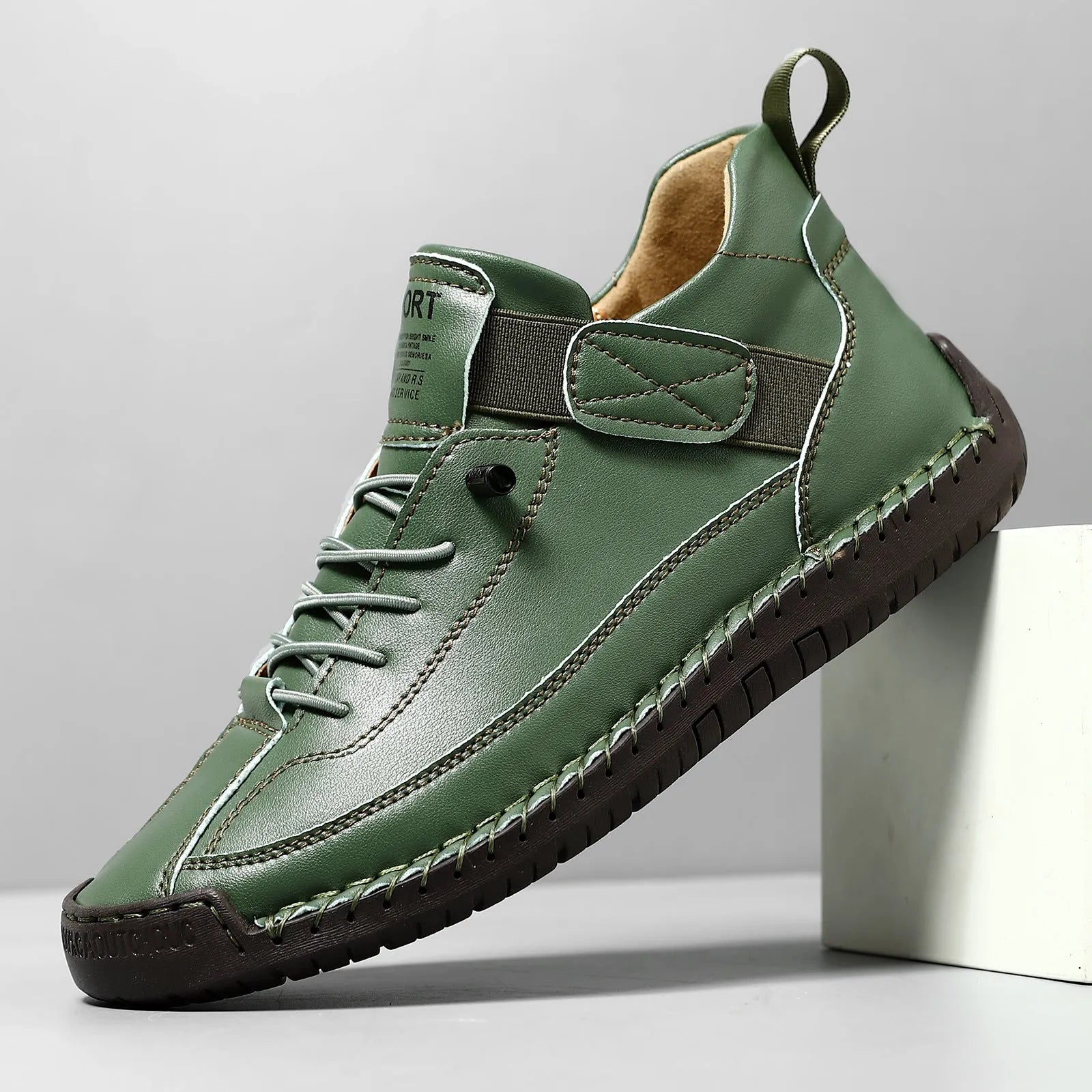 Men's mid-calf black Martin boots with tooling stitching and a flat rubber sole on a white background.