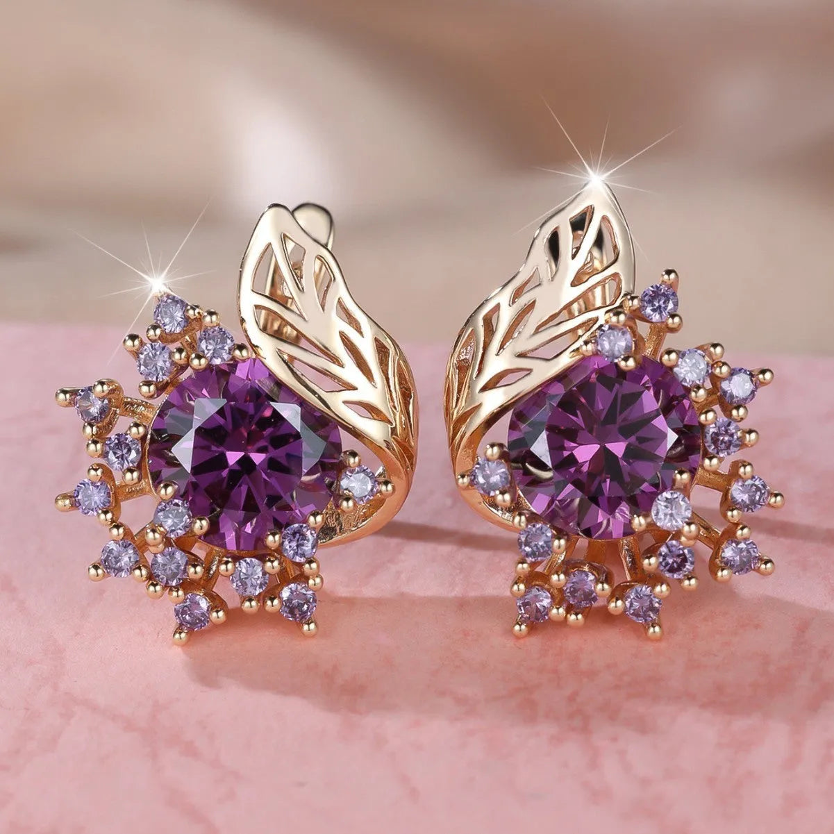 Round floral feather earrings in rose gold colour with crystal zircon stones, shown in six colour variations