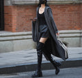 Long grey knitted hooded trench coat with a loose, cardigan-style fit and long sleeves.