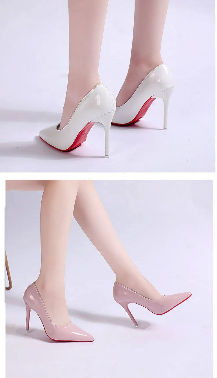 Women's black pointed toe stiletto pumps with a low-cut vamp and thin high heel on a white background.