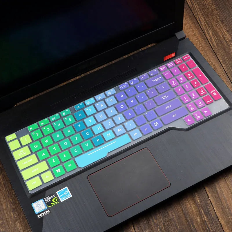 Clear protective keyboard film cover for ASUS Flight 14-inch laptop on a keyboard.