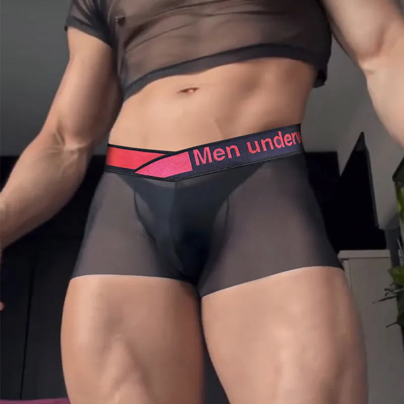 Men's black seamless low-waist underwear with a gradient laser design detail on the front.