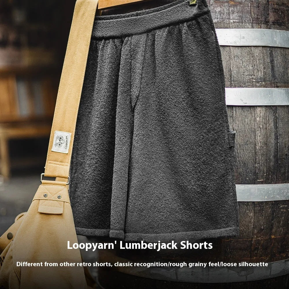 Heavy gray polyester sports shorts with straight leg design and elastic waistband