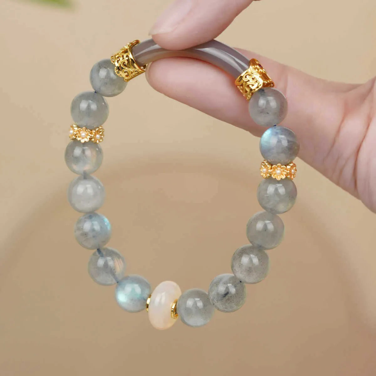 Emerald green jade bracelet with floating flower girl design in a half bracelet style.