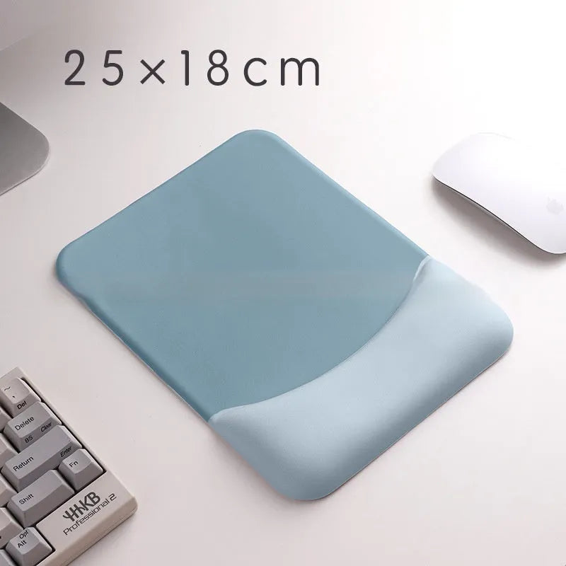 Square silicone wrist rest mouse pad with wrist strap in multiple colour options on a desk