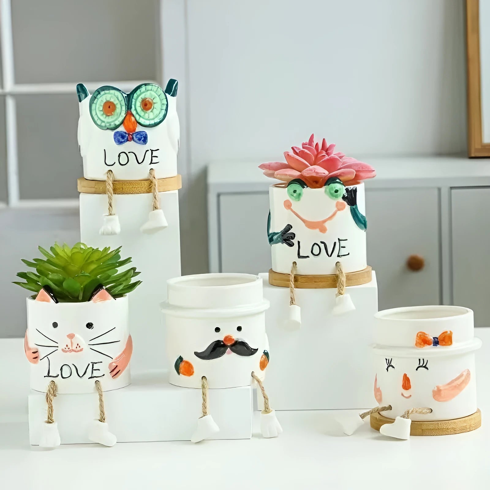 Ceramic hanging foot flowerpot in a cartoon style for desktop succulents.
