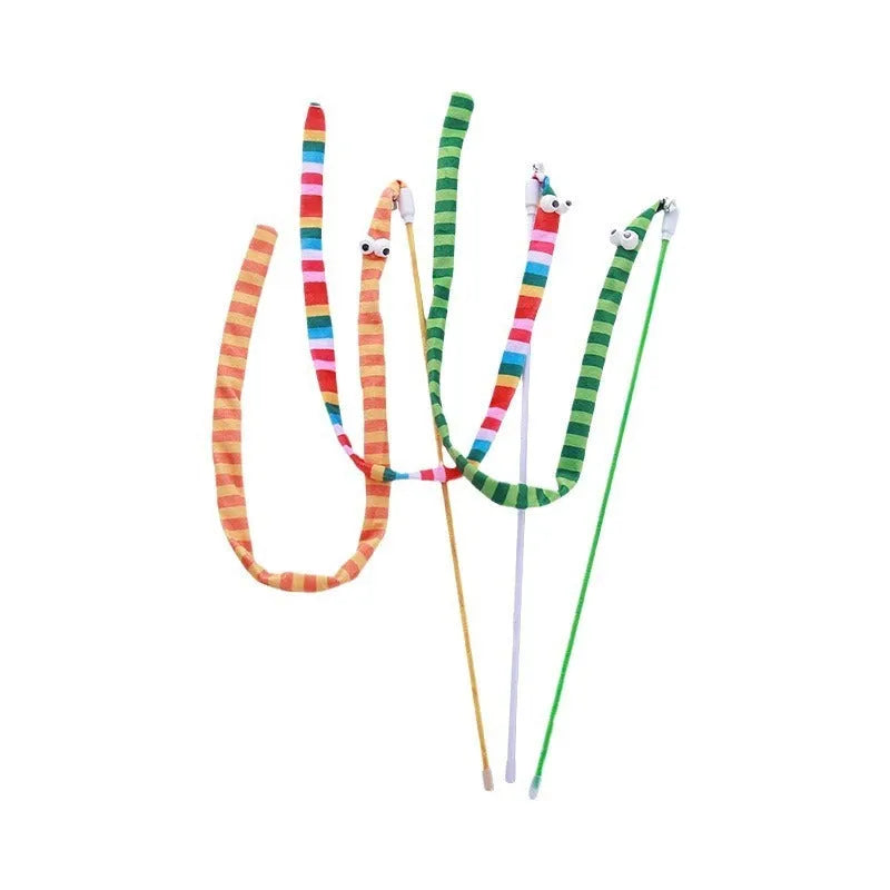 Colourful cat teaser wand with a long plush strip and a bell, held by a person.