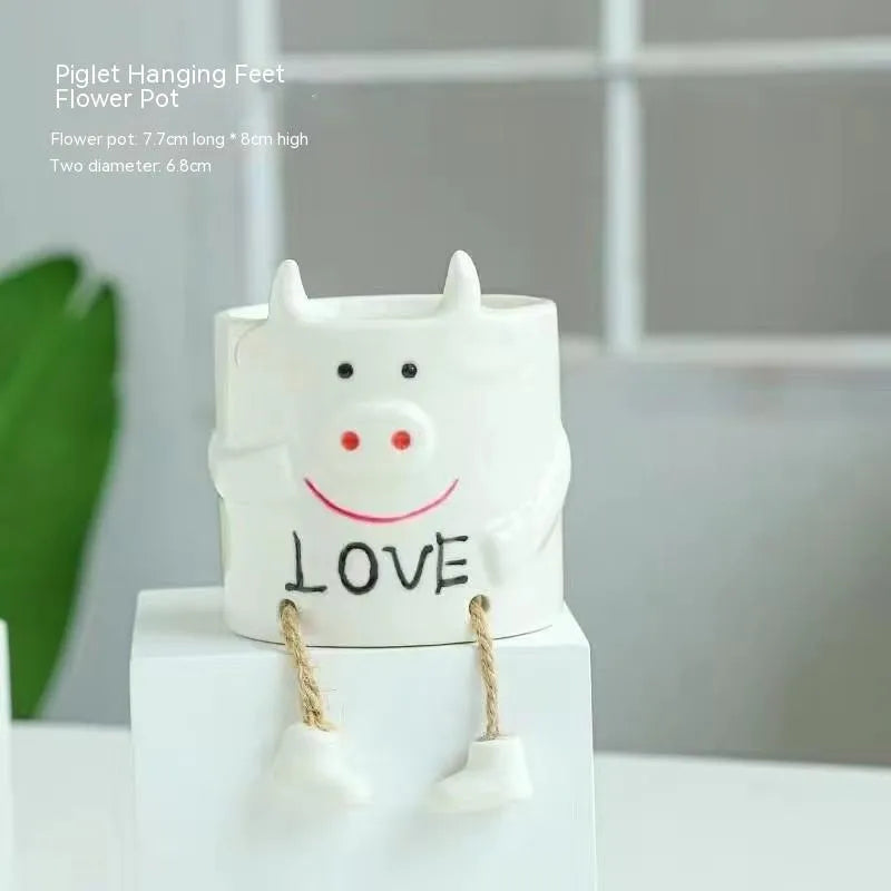 Ceramic hanging foot flowerpot in a cartoon style for desktop succulents.