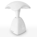 White modern plastic LED desk lamp with touch control on a wooden surface.