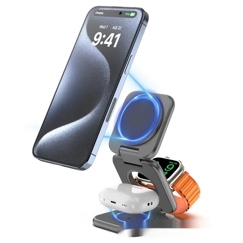White foldable magnetic wireless charging phone stand on a wooden desk next to a mobile phone.