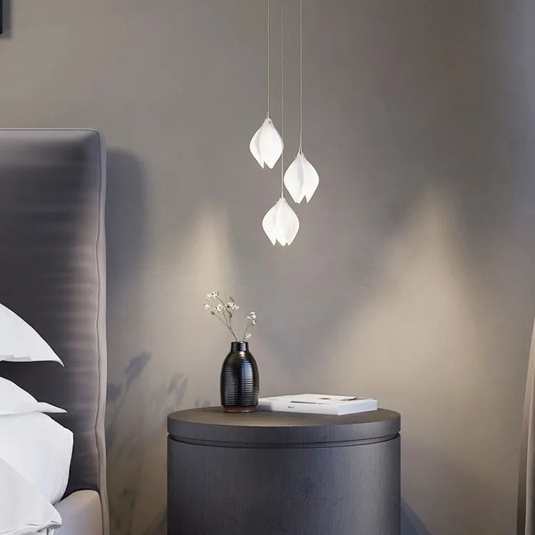 White ceramic magnolia flower single-head pendant ceiling light with dimmable bulb.