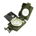 K4074 silver and black metal professional compass with hanging rope on a green background.