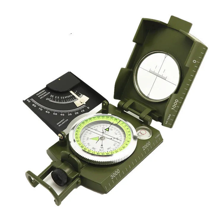 K4074 silver and black metal professional compass with hanging rope on a green background.