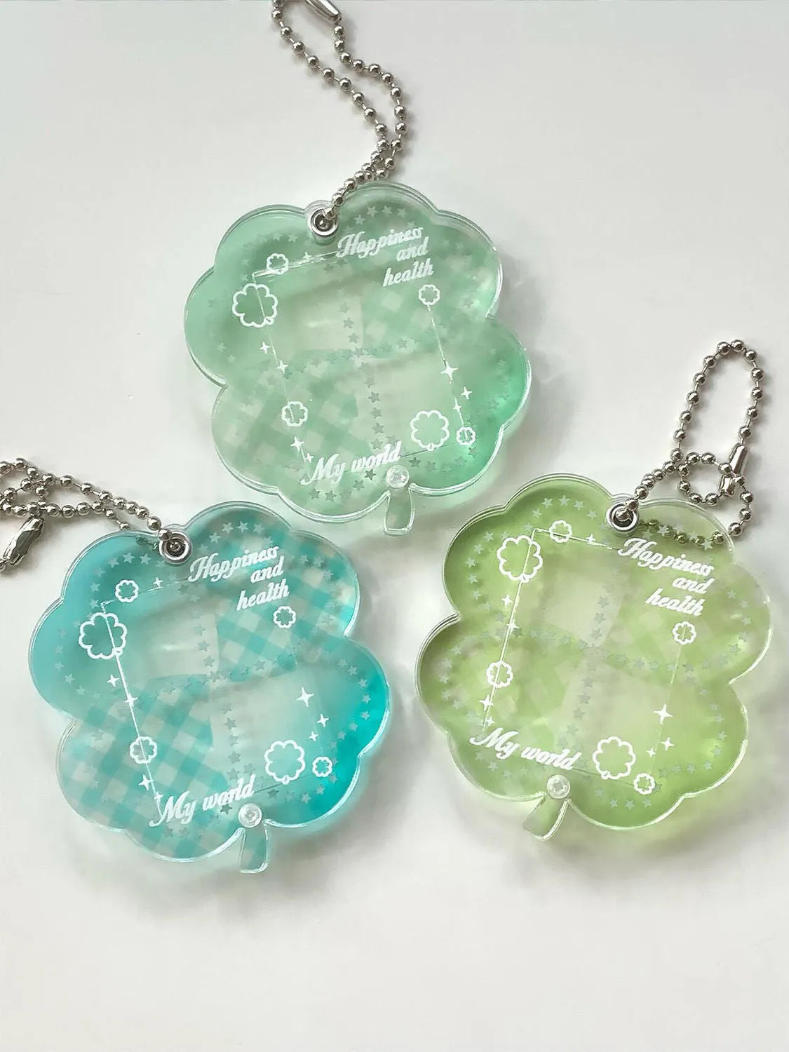 Acrylic four-leaf clover mobile phone pendant keychain in blue, green, and mint colours