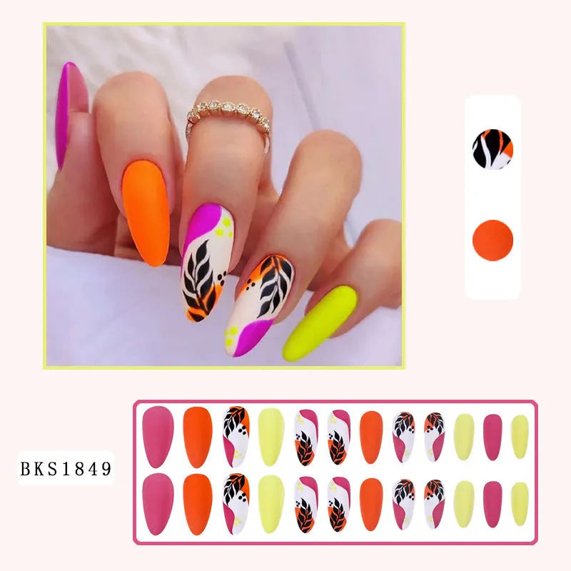 Wear Armour frosted finish nail stickers in medium almond shape showing four designs: French leaves, colourful plating, macarons, and leopard print.
