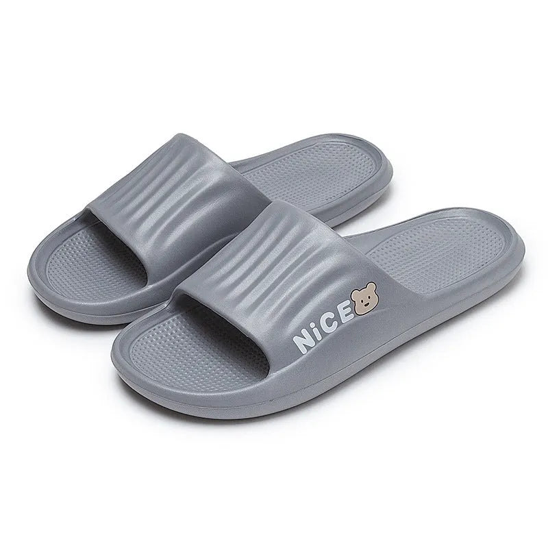 Adult unisex EVA bathroom slippers with cartoon pattern and non-slip sole in multiple colour options