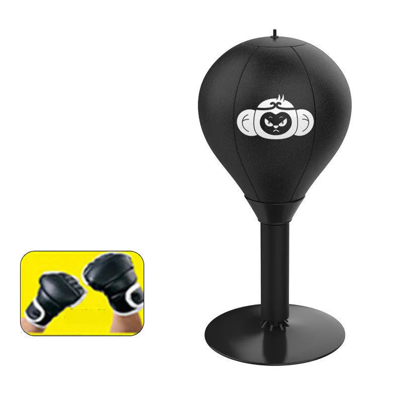 Tabletop boxing speed ball with suction cup base, inflatable PU leather sphere, and pump on a wooden desk.