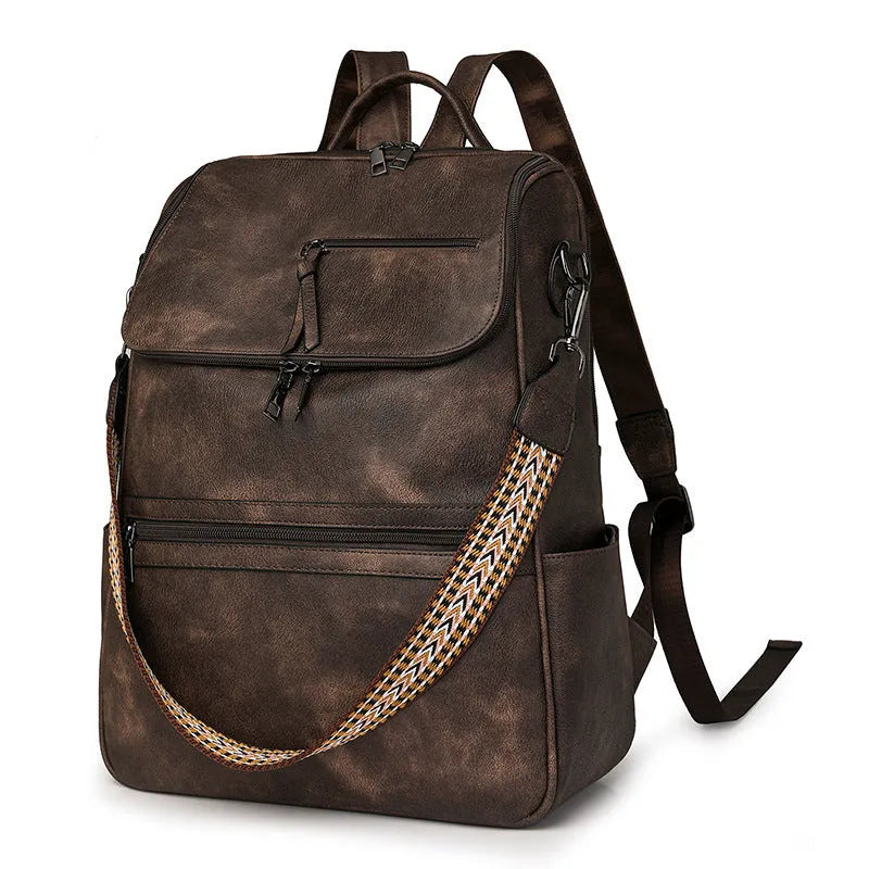 Solid colour retro college backpack with curved shoulder straps, shown in multiple colour options including black and blue.