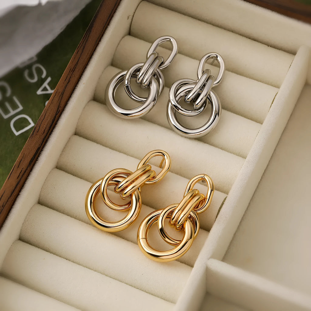 Women's gold geometric earrings with irregular shapes and high-profile metallic style