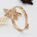 Geometric titanium steel bracelet in rose gold electroplated finish on white background
