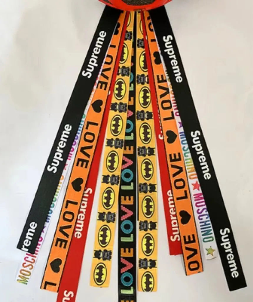 A colourful helmet streamer accessory for children's sports helmets and doll decoration.