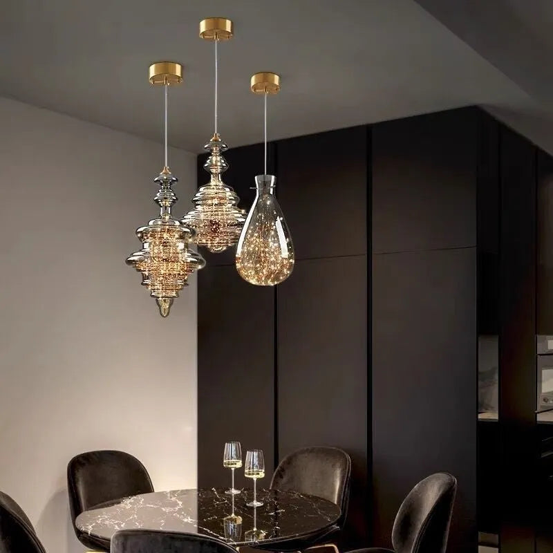 Modern glass droplight chandelier with adjustable height mechanism showing glass construction