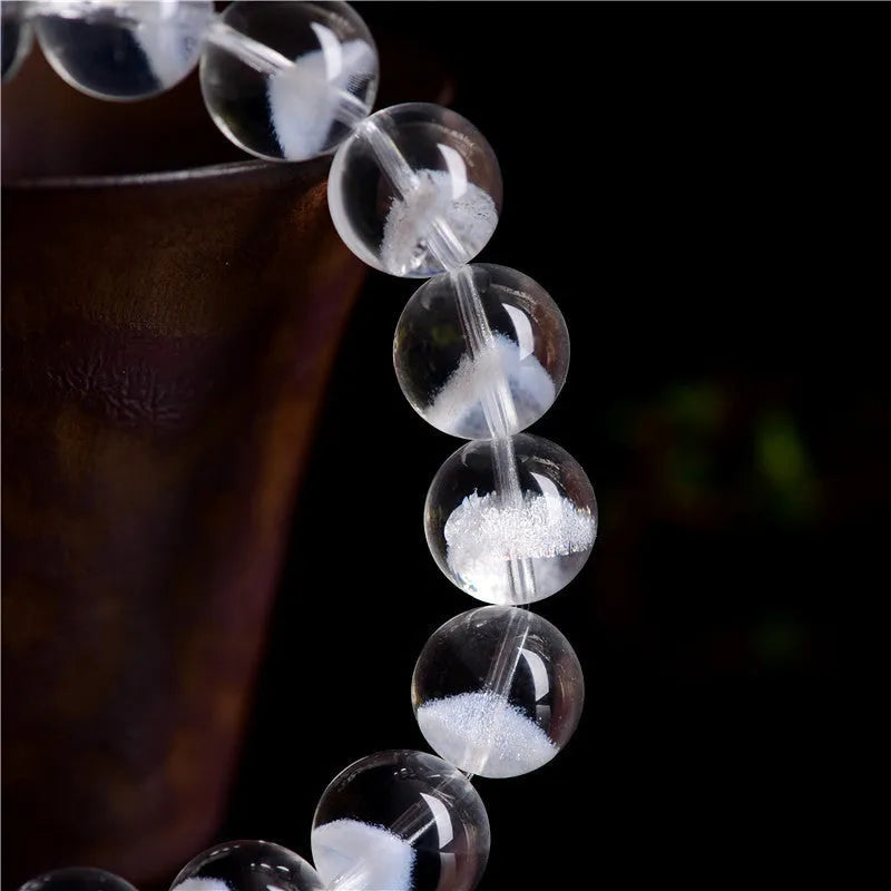 Women's white crystal pyramid bracelet with Ruyi design elements showing pyramid shapes and adjustable sizing