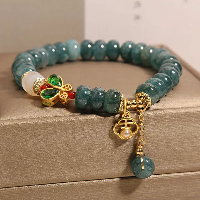 Blue water jade abacus beads crystal bracelet with white agate and rhinestone accents on alloy
