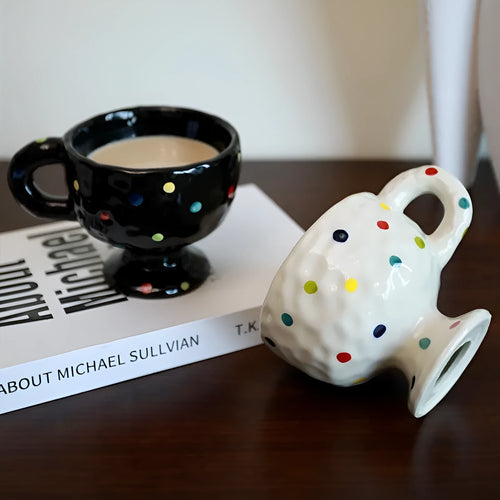 Hand-pinched irregular shaped ceramic mug in solid colour with modern simplicity design