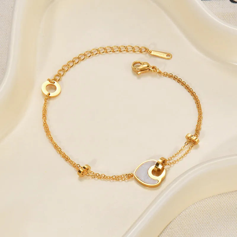 Women's stainless steel bracelet with double-layered resin heart design