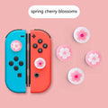 Four silicone thumbstick grip caps for Nintendo Switch Lite console in assorted colours