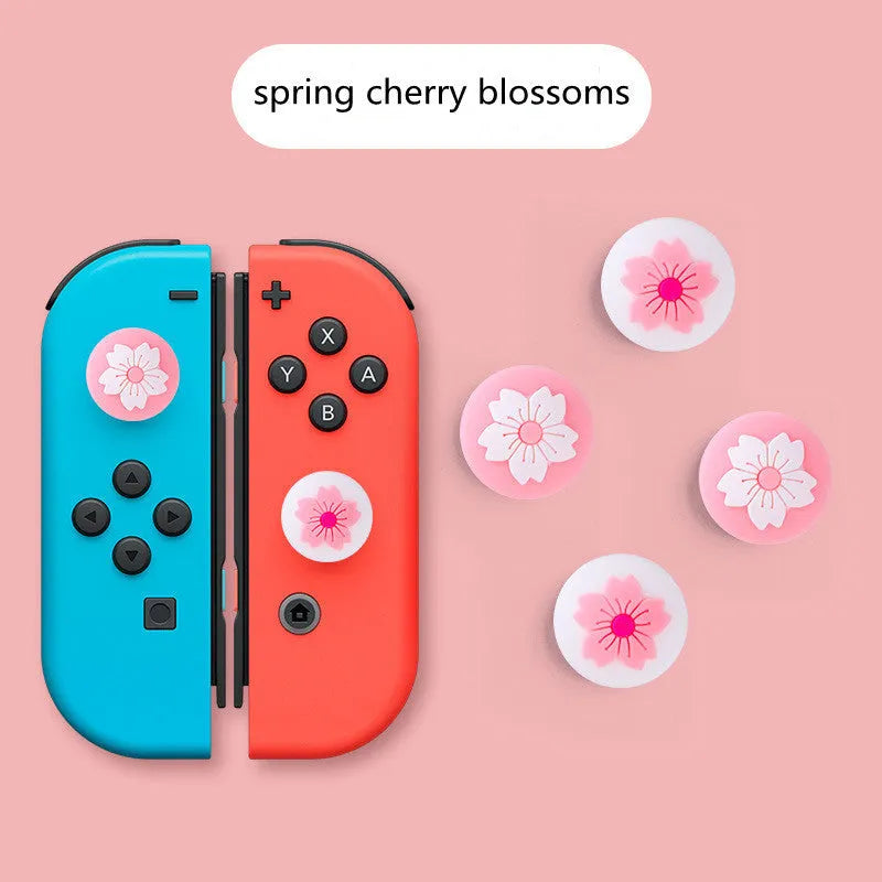 Four silicone thumbstick grip caps for Nintendo Switch Lite console in assorted colours