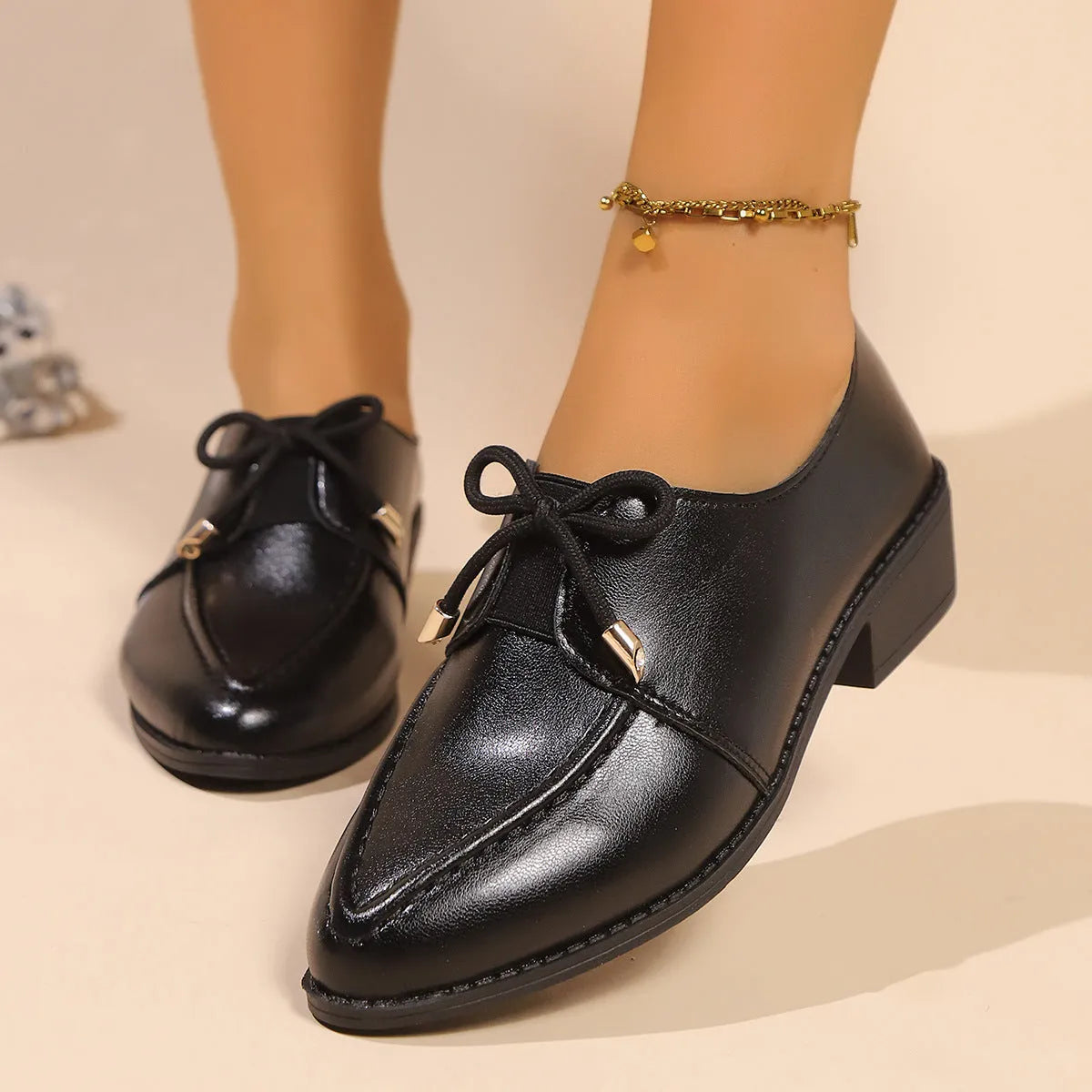 Women's British-style leather shoes with decorative bow on pointed toe, available in three bow style variations